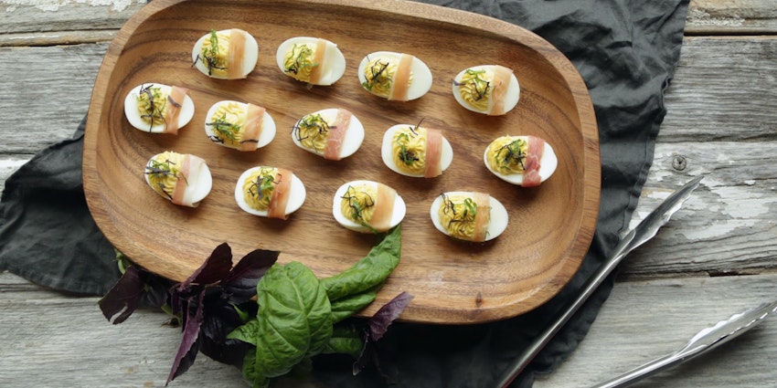 ​Roasted Garlic Deviled Eggs with Prosciutto & Basil